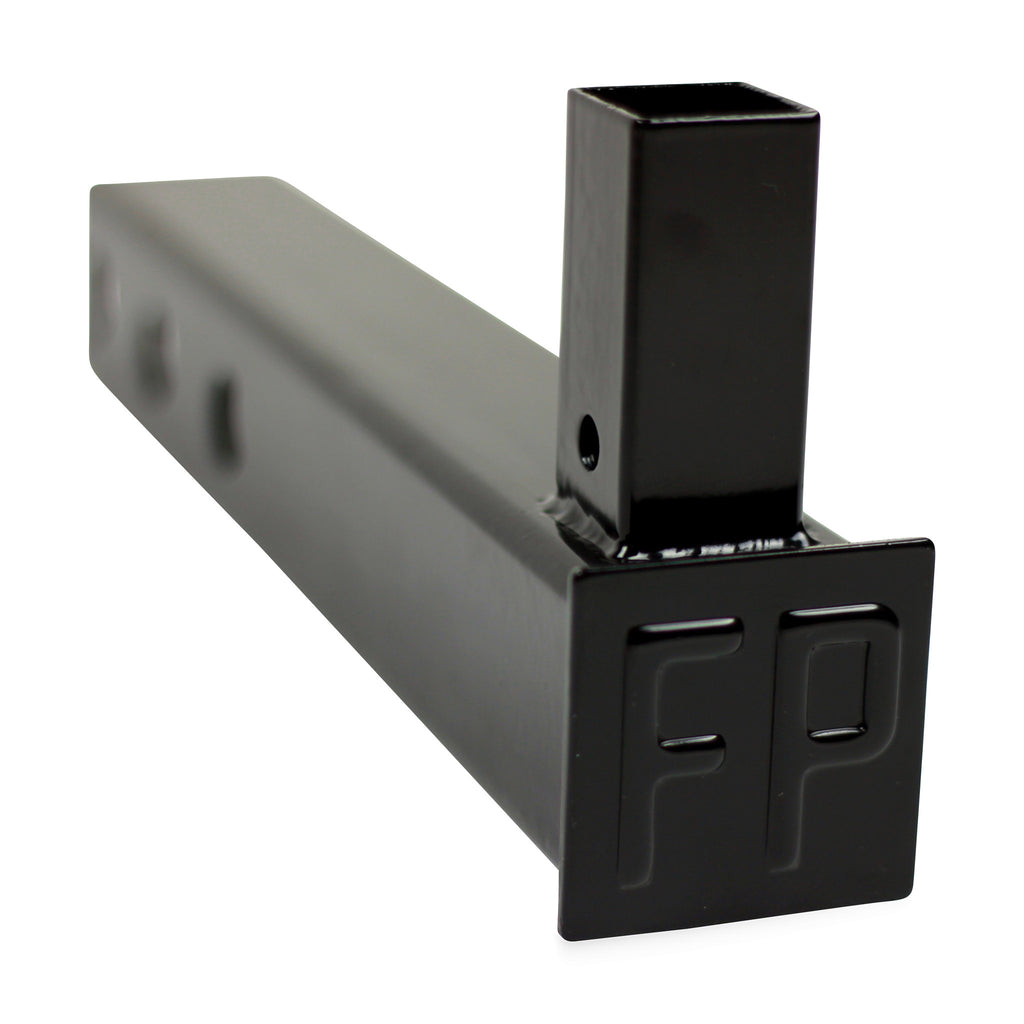 FanPole black steel dummy hitch for a 2-inch receiver with vertical pole sleeve and embossed FP end plate, front three-quarter view