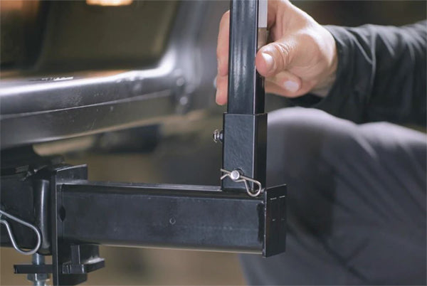 Hand setting the FanPole bottom pole into the dummy hitch in a 2-inch receiver